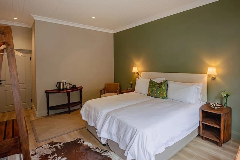 A Manor House suite with a king bed and garden outlook