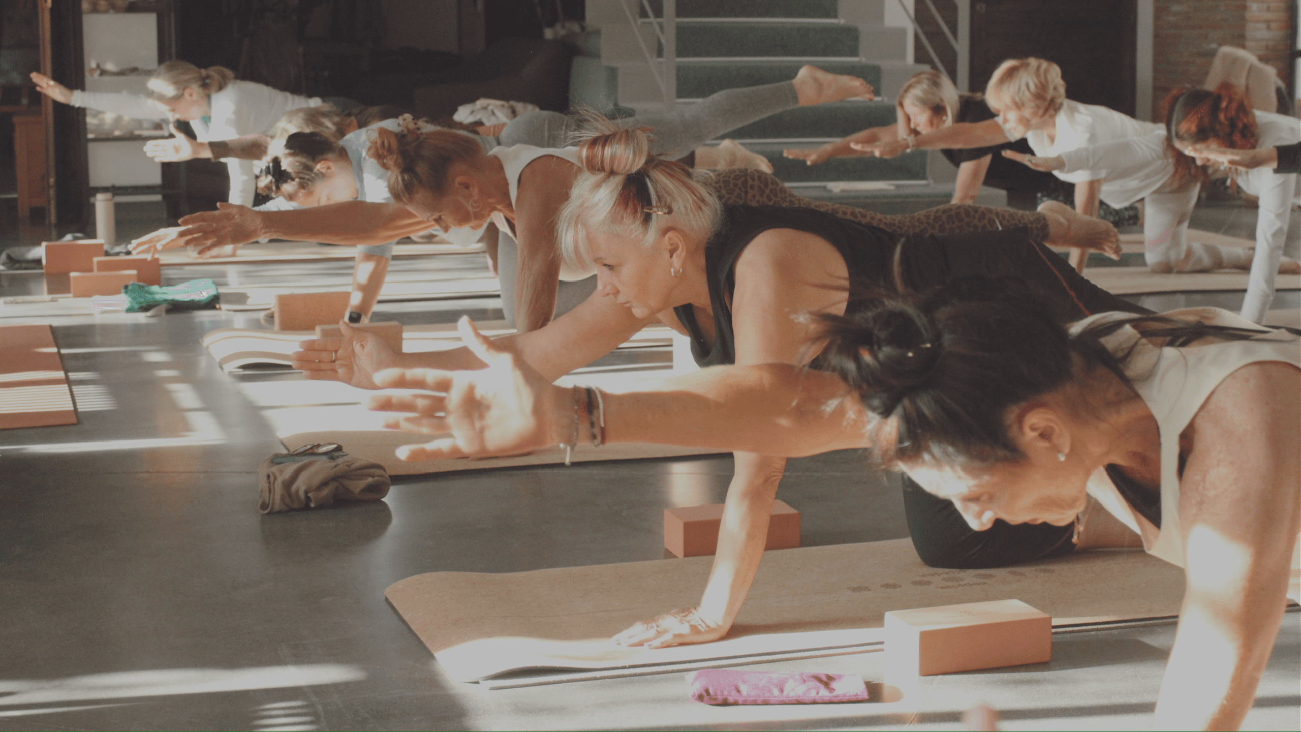 A yoga student seated in a calm, centring moment