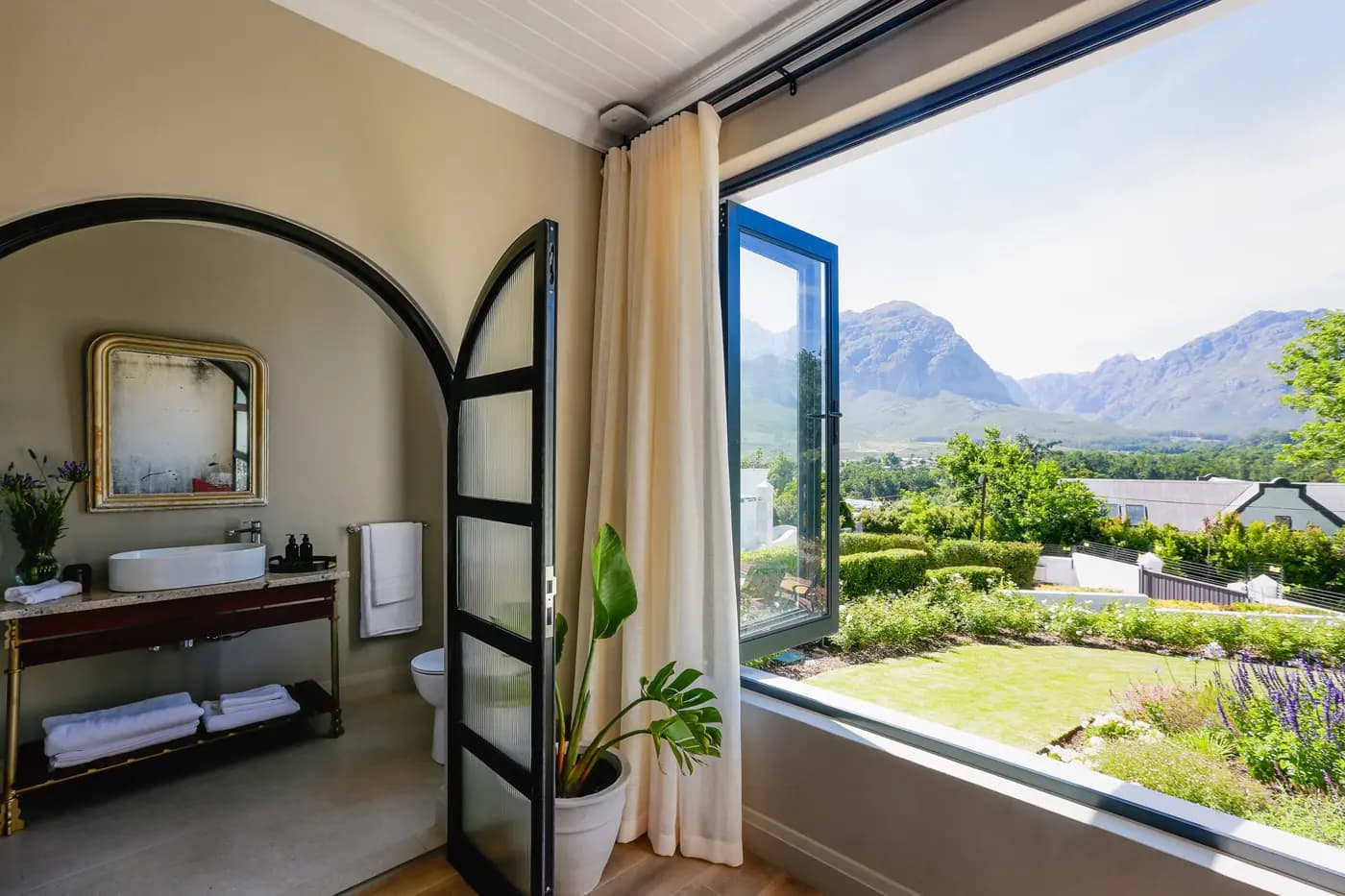 A luxury suite with large windows framing the mountains