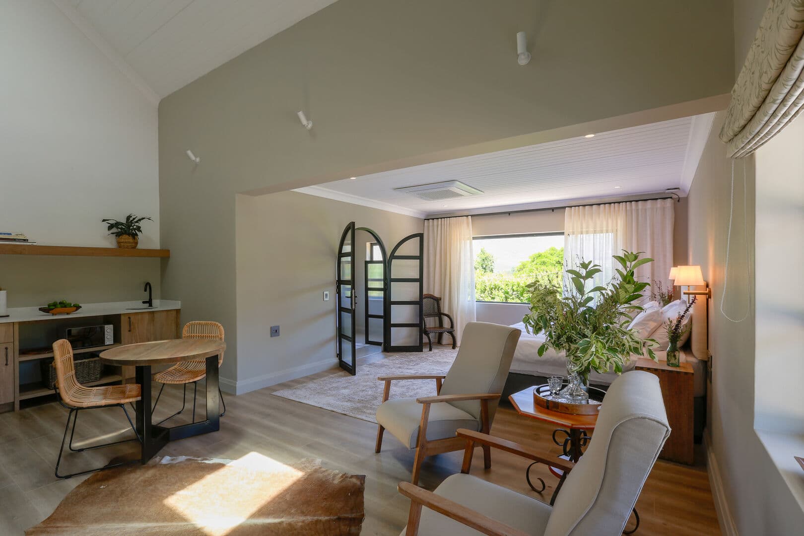 A luxury suite with a private sitting area and veranda